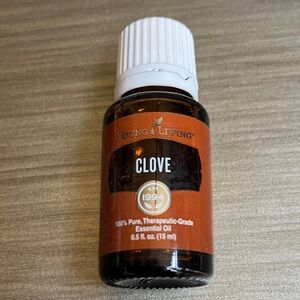 Young Living Clove Essential Oil in Brown and White